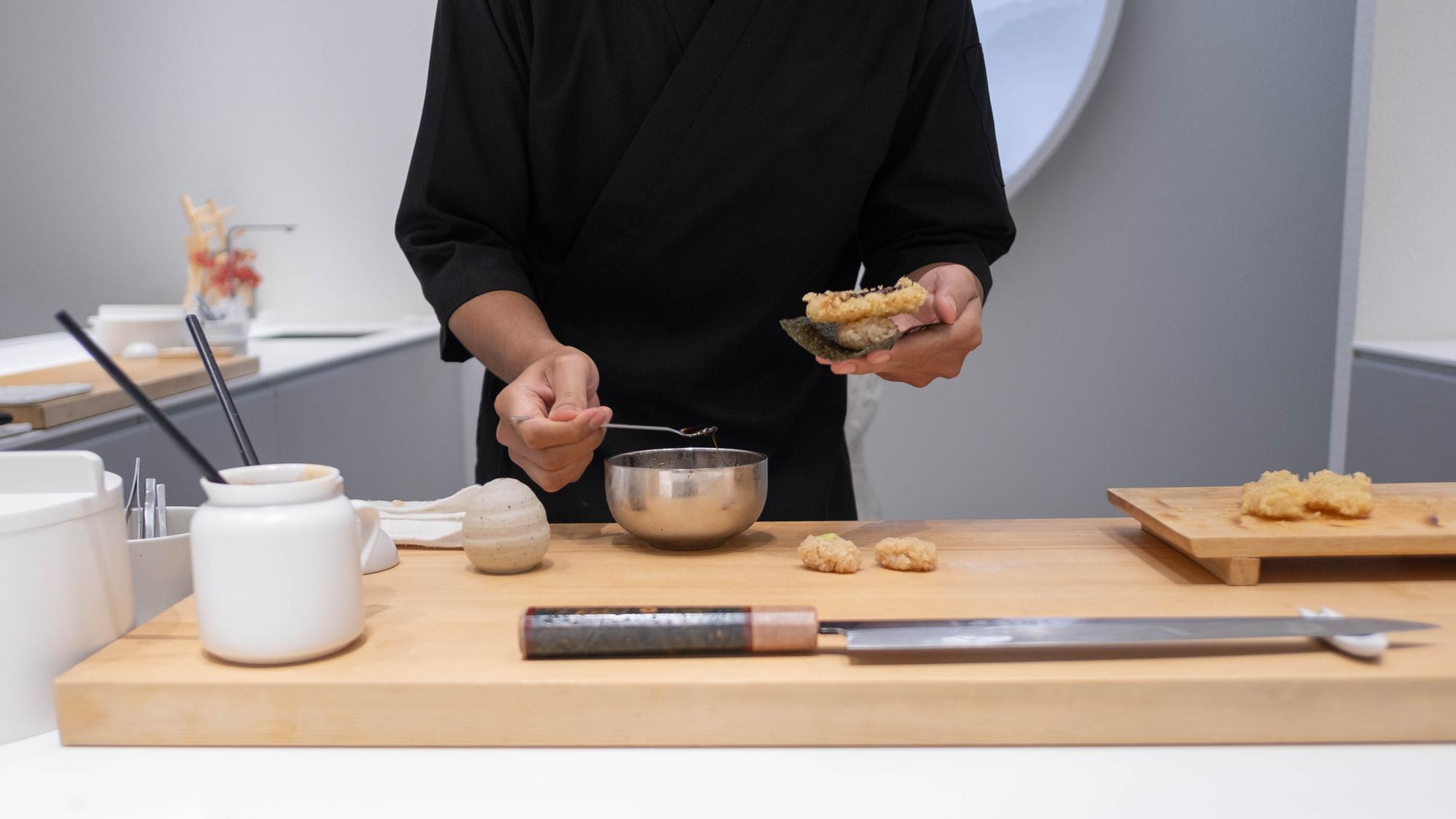 studio consultation notes beside plated dish